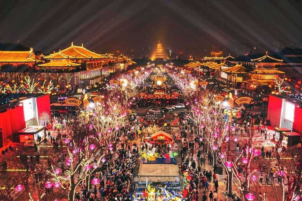The vibrant night life at Grand Tang Mall with many activities like shopping, walking and watching traditional performances